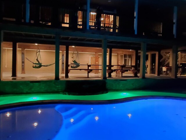 388 County Road 5597, Etoile, TX 75944 - view of back of house at twilight