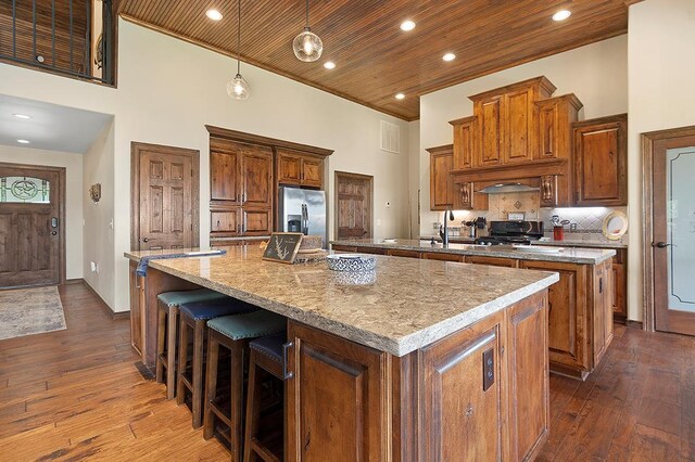 388 County Road 5597, Etoile, TX 75944 - kitchen with a spacious island, stainless steel refrigerator with ice dispenser, a high ceiling, dark wood-style flooring, and wood ceiling