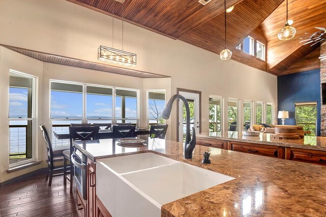 388 County Road 5597, Etoile, TX 75944 - dining space with wooden ceiling, high vaulted ceiling, healthy amount of natural light, and dark wood-style flooring