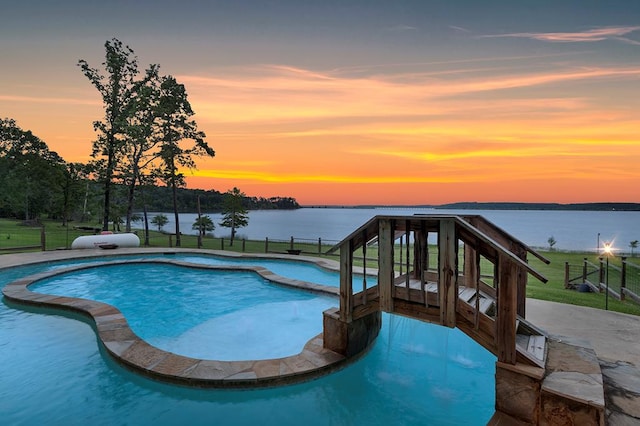 388 County Road 5597, Etoile, TX 75944 - pool at dusk with a pool with connected hot tub and a water view