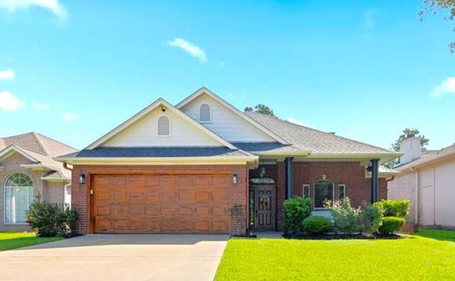 view of front of house featuring a front yard and a garage