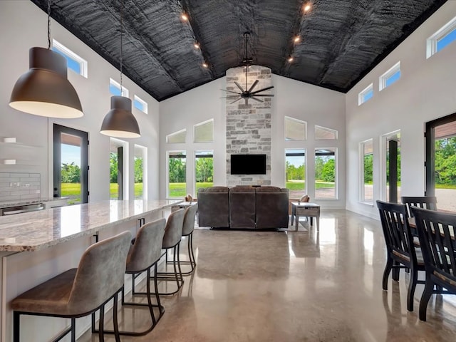 10165 US Highway 287, Corrigan, TX 75939 - dining area with a high ceiling, a ceiling fan, and finished concrete floors