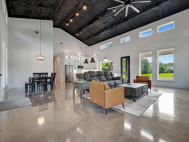 10165 US Highway 287, Corrigan, TX 75939 - living area featuring a high ceiling, concrete flooring, and ceiling fan