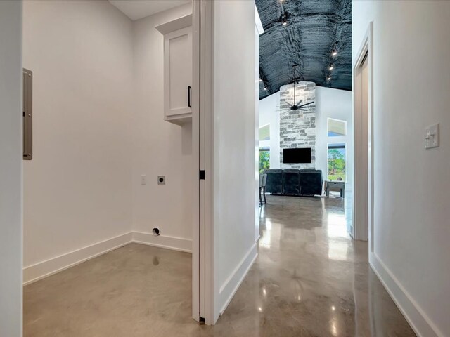 10165 US Highway 287, Corrigan, TX 75939 - hallway with concrete flooring, a towering ceiling, and electric panel