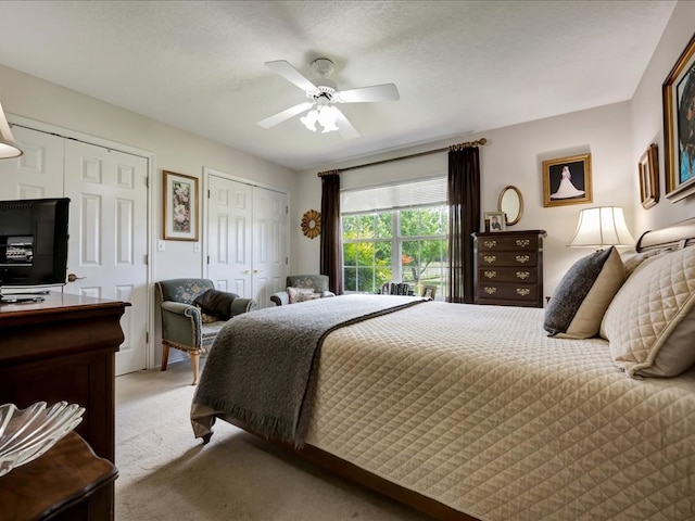 325 Evans Gann Rd, Lufkin, TX 75904 - bedroom with light colored carpet, two closets, and a ceiling fan