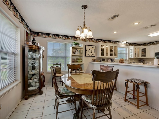 325 Evans Gann Rd, Lufkin, TX 75904 - dining space with light tile patterned floors, a chandelier, and recessed lighting