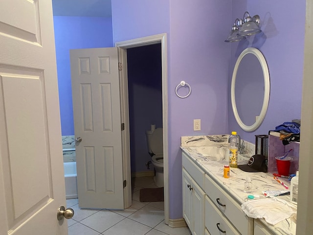 bathroom with tile patterned floors, vanity, and toilet