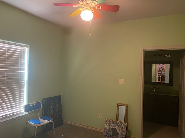 miscellaneous room featuring carpet, a wealth of natural light, and ceiling fan