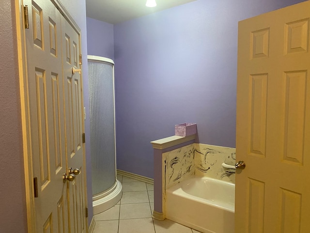 bathroom with tile patterned flooring and plus walk in shower