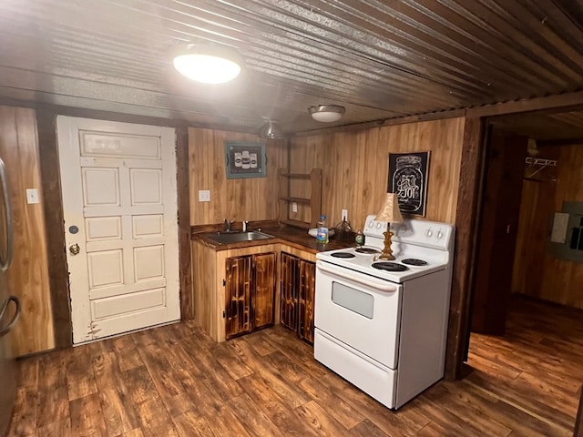 kitchen with white electric range oven, sink, wood walls, wood ceiling, and dark hardwood / wood-style flooring