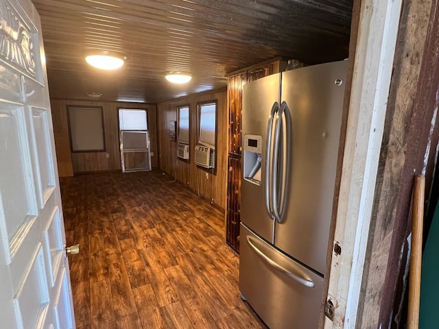 kitchen with wooden walls, cooling unit, stainless steel fridge, dark hardwood / wood-style flooring, and wooden ceiling