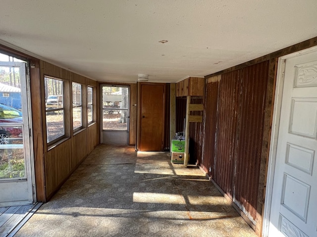 unfurnished sunroom with a wealth of natural light