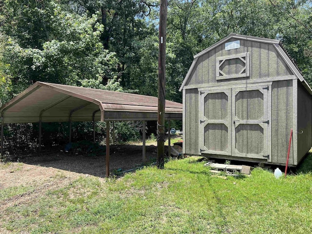 view of outbuilding with a carport and a yard