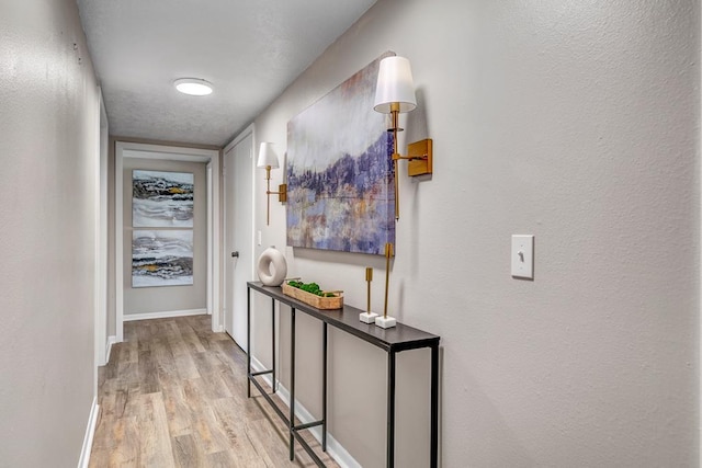 hallway featuring light wood-type flooring