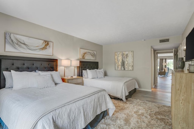 bedroom with light wood-type flooring