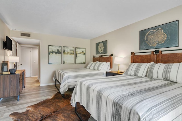 bedroom featuring light hardwood / wood-style flooring