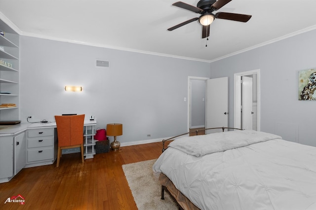 bedroom featuring baseboards, visible vents, a ceiling fan, wood finished floors, and crown molding