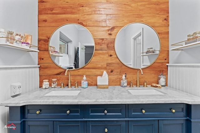 full bathroom featuring a sink and double vanity