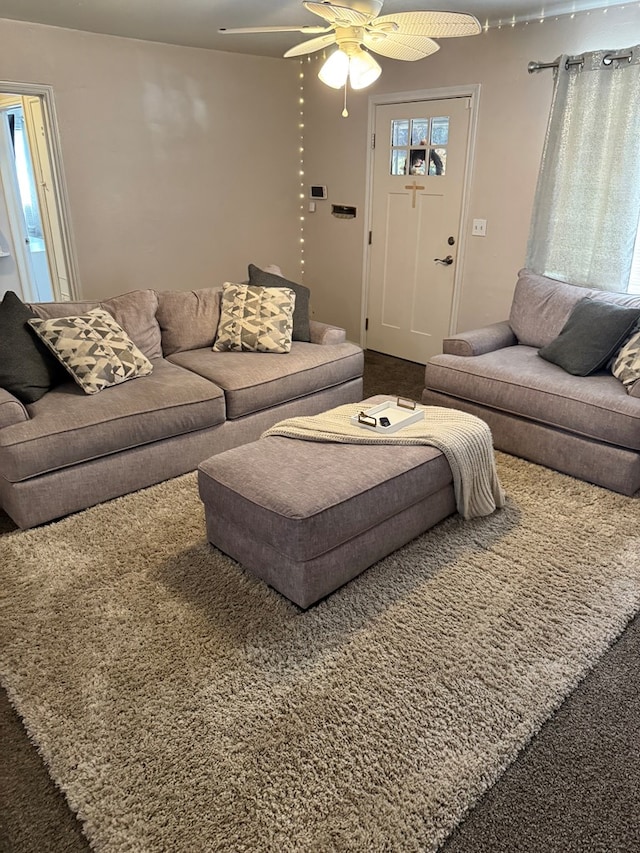 living room featuring a ceiling fan