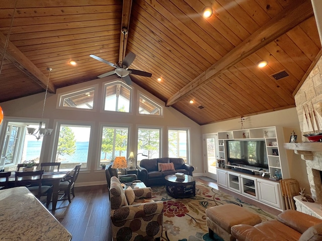 living room with dark hardwood / wood-style floors, a fireplace, high vaulted ceiling, beamed ceiling, and wood ceiling