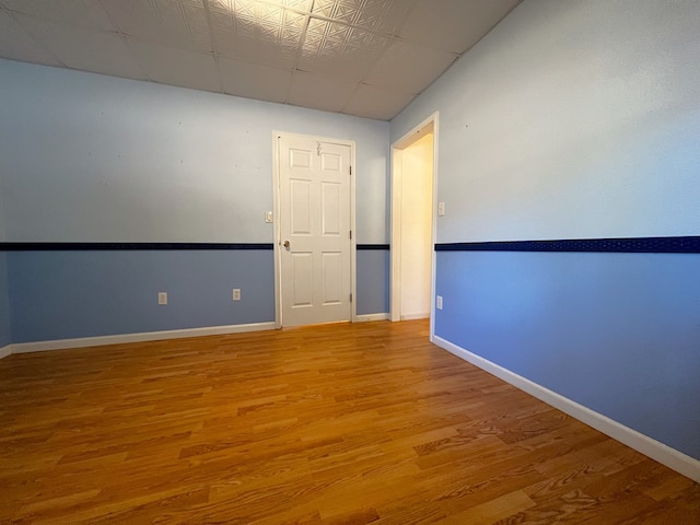 spare room featuring hardwood / wood-style flooring