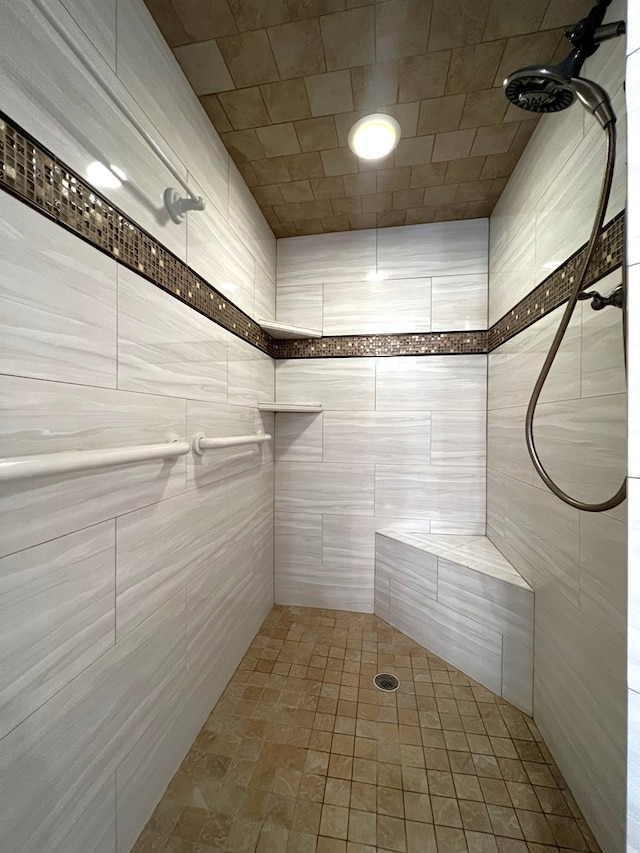 bathroom featuring a tile shower