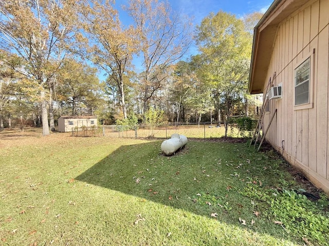 view of yard featuring a wall mounted air conditioner