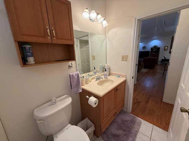 bathroom featuring vanity, toilet, and wood-type flooring