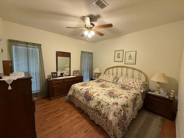 bedroom with hardwood / wood-style flooring and ceiling fan