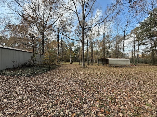 view of yard featuring a carport