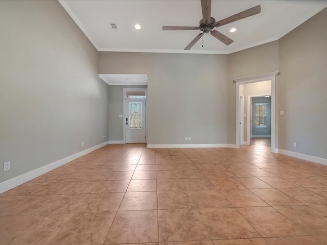 empty room featuring light tile patterned floors, ceiling fan, and crown molding