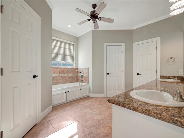 bathroom with tile patterned floors, ceiling fan, a bathing tub, and ornamental molding