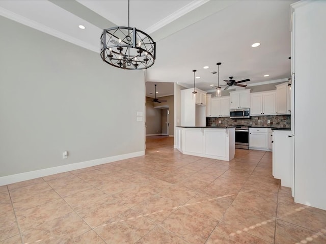 kitchen with pendant lighting, white cabinets, stainless steel appliances, and ceiling fan with notable chandelier