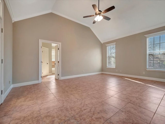 tiled empty room featuring vaulted ceiling, ceiling fan, and ornamental molding