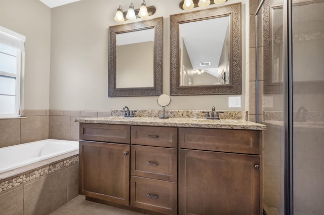 346 Northview Dr, Brookeland, TX 75931 - full bathroom with double vanity, a bath, and a tile shower