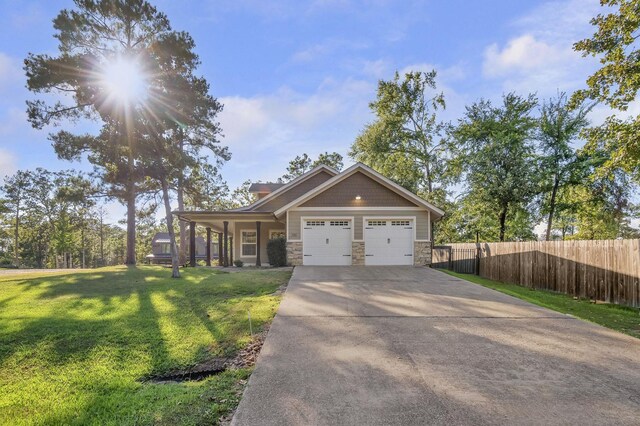 346 Northview Dr, Brookeland, TX 75931 - craftsman house with stone siding, concrete driveway, and an attached garage