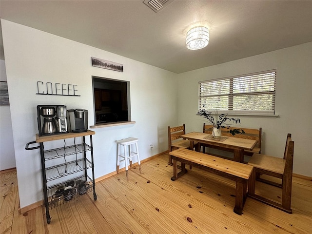 dining room with light hardwood / wood-style flooring