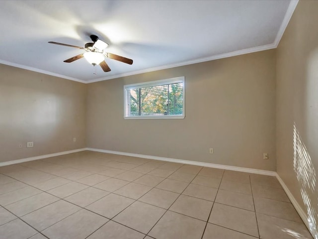 spare room with ceiling fan, light tile patterned floors, and ornamental molding