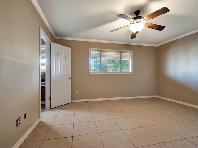 tiled spare room with ceiling fan and ornamental molding