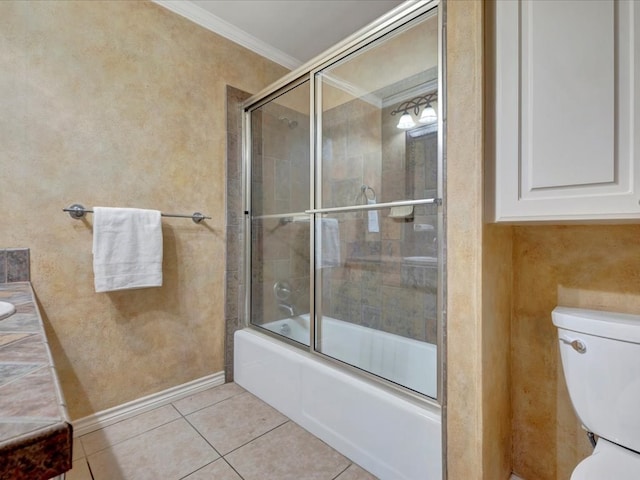 full bathroom with tile patterned flooring, enclosed tub / shower combo, crown molding, toilet, and vanity