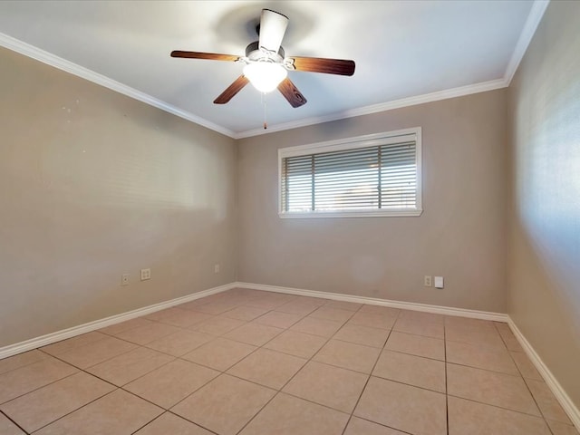 spare room featuring ceiling fan, ornamental molding, and light tile patterned floors