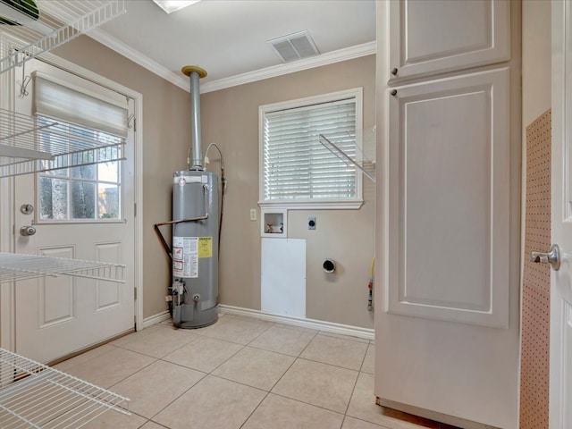 laundry area with hookup for an electric dryer, light tile patterned floors, gas water heater, and crown molding