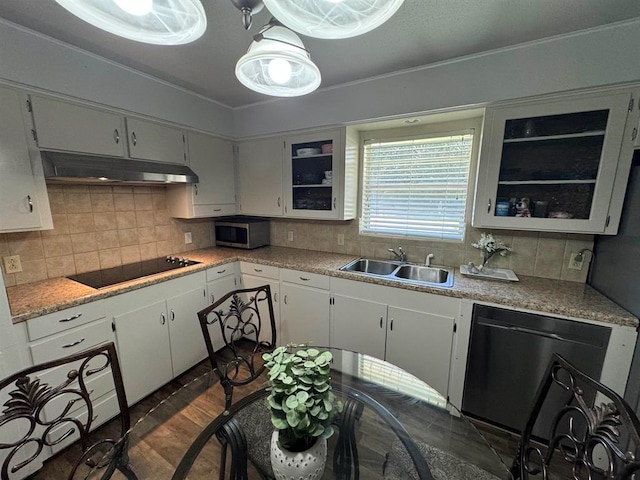 kitchen with sink, dark wood-type flooring, backsplash, white cabinets, and appliances with stainless steel finishes