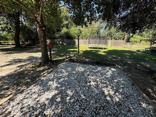 view of yard with a trampoline