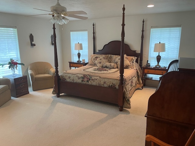 carpeted bedroom featuring ceiling fan