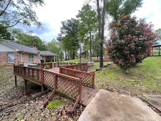 view of yard featuring a wooden deck