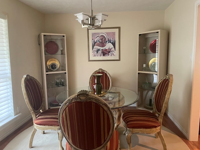 dining space featuring a chandelier and light hardwood / wood-style flooring