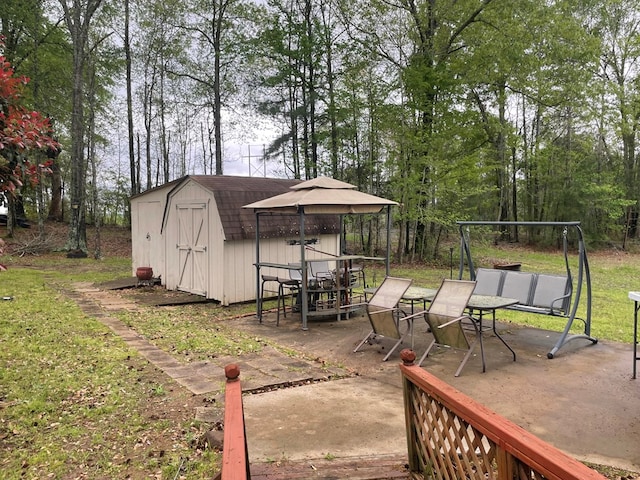 exterior space featuring a shed and a patio area