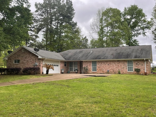 single story home with a garage and a front lawn