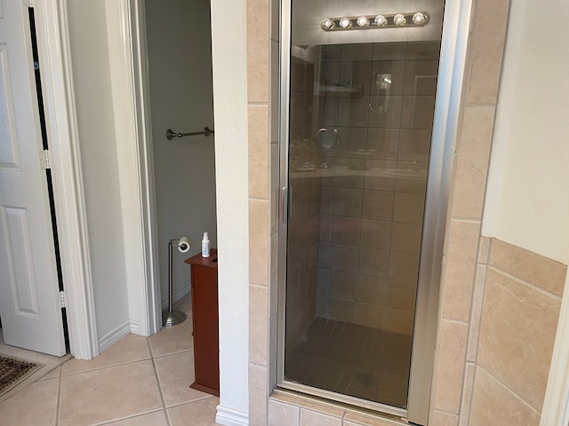 bathroom featuring tile patterned flooring and walk in shower